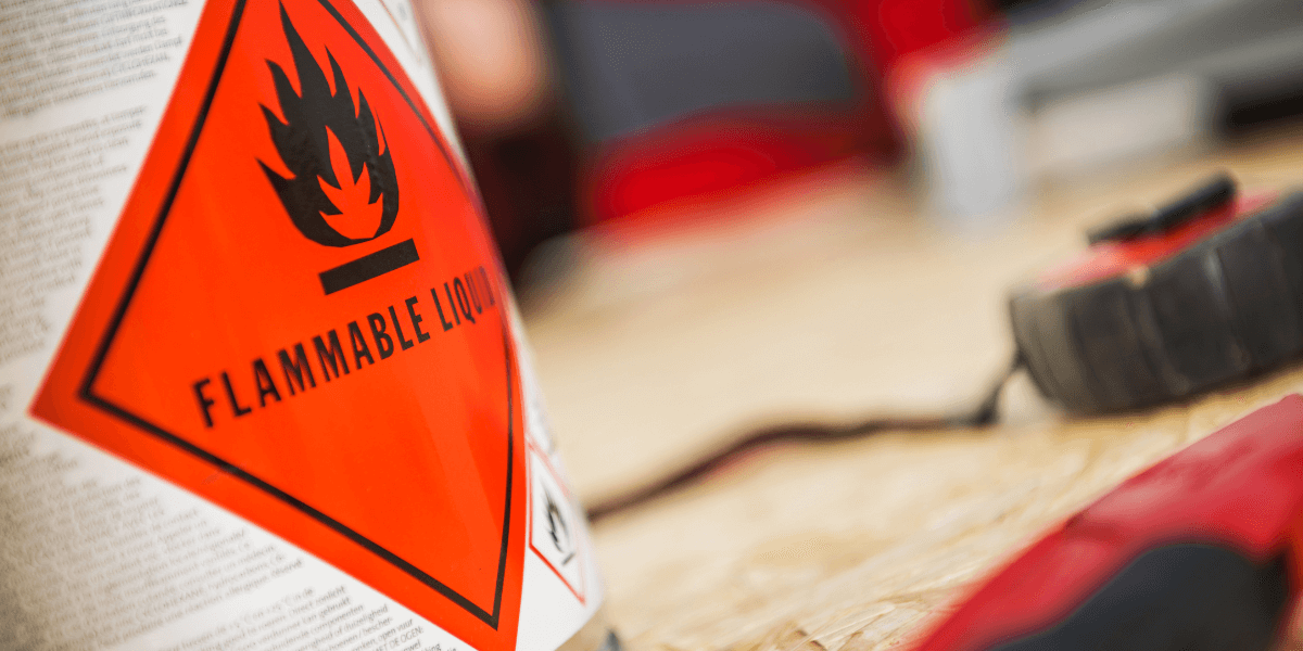 A can with a red warning label that says flammable liquid